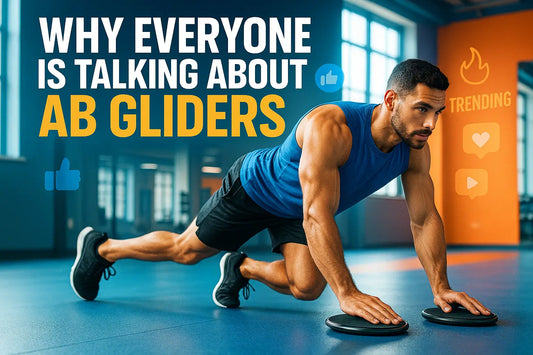 A black ab glider placed on the floor of a bright, modern gym with wooden floors and natural light streaming through large windows, surrounded by weights and workout equipment.