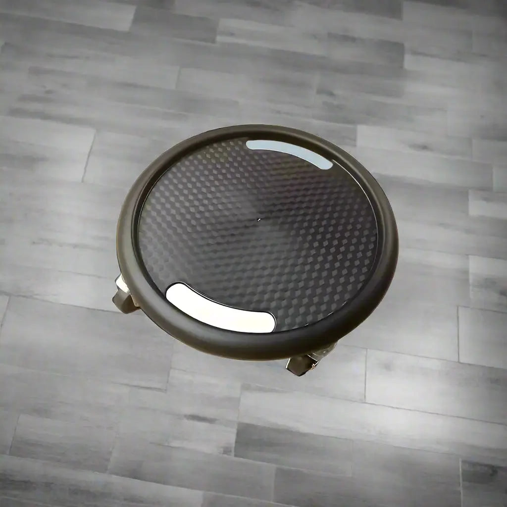 Black round speaker grill with measurements on a white background