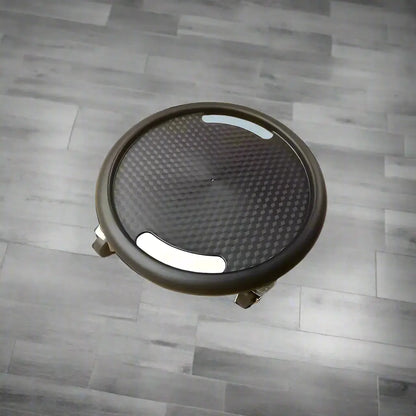 Black round speaker grill with measurements on a white background